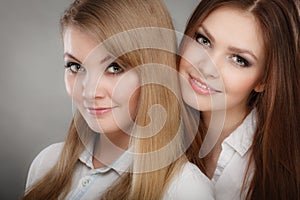 Lovely playful sisters women portrait.