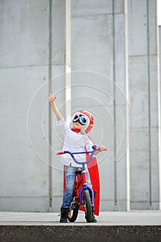 A funny, little superhero. Concept boy imagination. Happy childchood. photo