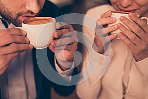 Lovely romantic couple sitting in a cafe drinking coffee