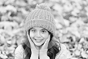 Lovely season. Autumn skin care routine. Kid wear warm knitted hat. Warm woolen accessory. Girl long hair happy face