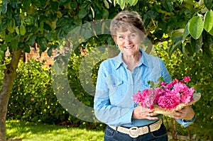 Lovely Senior in Her Garden with Pink Rose Bouquet