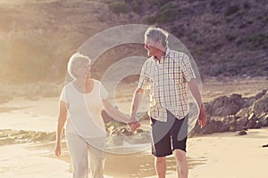 Lovely senior mature couple on their 60s or 70s retired walking