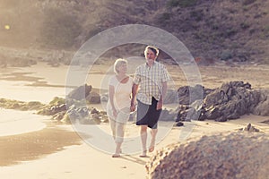 Lovely senior mature couple on their 60s or 70s retired walking