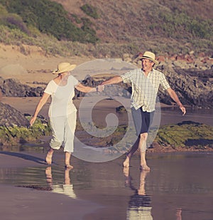 Lovely senior mature couple on their 60s or 70s retired walking