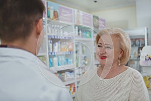 Lovely senior woman shopping at drugstore