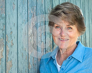 Lovely Seventy Year Old Woman Smiling in Blue Shir