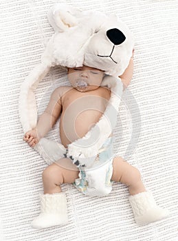 Lovely sleeping baby with big bear