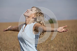 Lovely smiling woman enjoying the sun