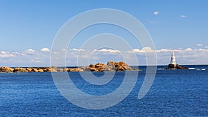 Lovely summer afternoon at the pier in town of Ahtopol with views of the lighthouse. Bulgaria.