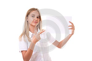 Lovely teen girl in white shirt pointing at the advertising sign board,isolated