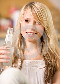 Lovely teenage girl with bottle of water