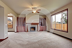 Lovely unfurnished living room with carpet.