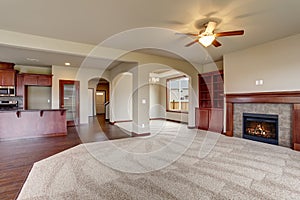 Lovely unfurnished living room with carpet.