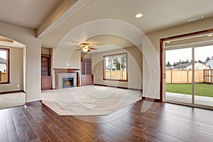 Lovely unfurnished living room with carpet.