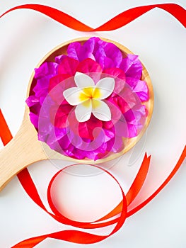 Lovely valentine day idea concept, Isolated fresh colorful flowers with red heart symbol ribbon decorated on white background