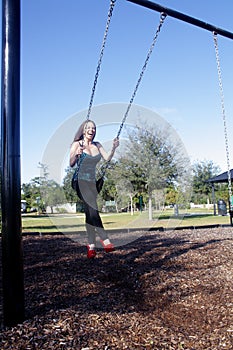 Lovely, Voluptuous Brunette on a Swing (9)