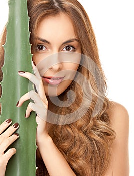 Lovely woman with aloe vera