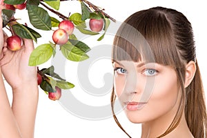 Lovely woman with apple twig