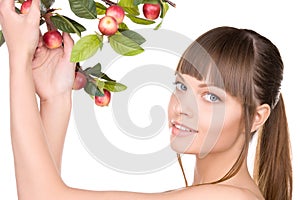 Lovely woman with apple twig