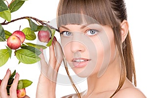 Lovely woman with apple twig