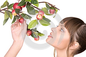 Lovely woman with apple twig