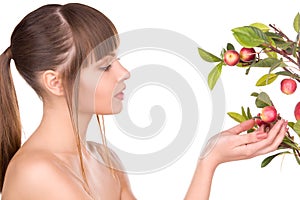 Lovely woman with apple twig