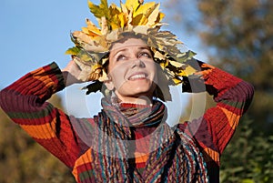 Lovely woman with autumn wreath on her head