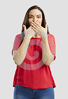 Lovely woman with hands on mouth