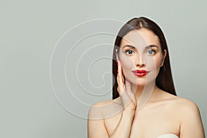 Lovely woman with healthy clear skin on white. Skincare and facial treatment concept