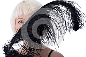 Lovely woman hiding face of black feather