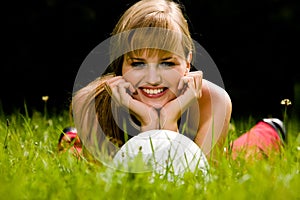 Lovely woman lying on a grass