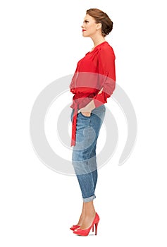 Lovely woman in red blouse and jeans