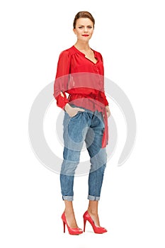 Lovely woman in red blouse and jeans