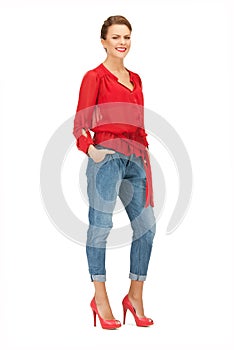 Lovely woman in red blouse and jeans