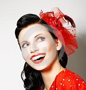 Vitality. Cheerful Young Woman with Red Bow enjoying. Pleasure photo