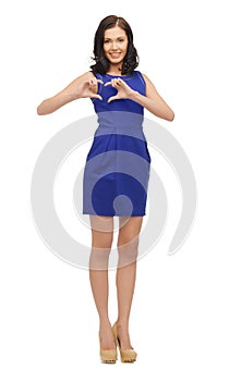 Lovely woman showing heart shape