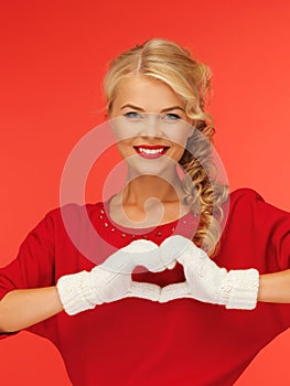 Lovely woman showing heart shape