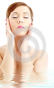 Lovely woman washing face