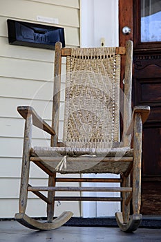 Lovely wood rocking chair on front porch