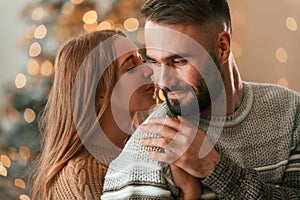 Lovely young couple are celebrating New Year at home