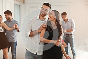 Lovely young couple dancing together