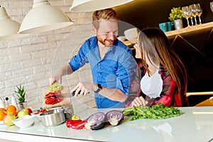 Young couple preparing healthy meal in the kitchen