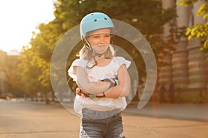 Lovely young girl enjoying rollerblading outdoors