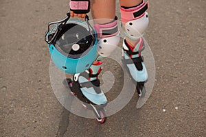 Lovely young girl enjoying rollerblading outdoors