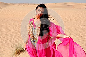 Lovely young woman in arabic desert