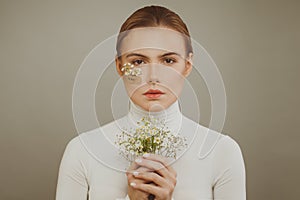 Lovely young woman with flowers and Hope inscription on white background