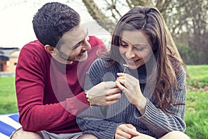 Lover boy gives a daisy to her girlfriend