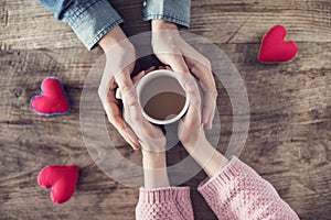 Lover holding coffee mug