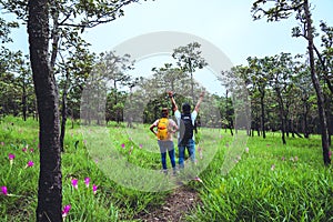 Lover woman and men Asian travel nature. Travel relax. Photography Cucumber sessilis flower field