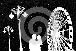 Lovers in amusement park at night